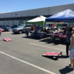 TCI Employees enjoying a delicious BBQ and playing cornhole.