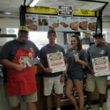 Team members congratulate a new c-store on their first pizza sold!
