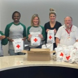 For National Volunteer Week, the Executive Assistants packaged 500 comfort kits for the Red Cross. 