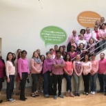 Some team members showing support for Breast Cancer Awareness Day in 2018.